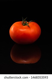 Tomato On A Black Shinny Floor