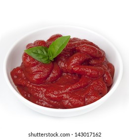 Tomato Paste In Small White Bowl, With Basil.