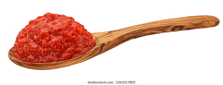 Tomato paste in wooden spoon isolated on white background, full depth of field