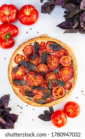 Tomato Pie With Red Baisils, Ricotta Cheese, Eggplants, Orange Zest. Top View.