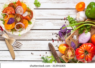 Tomato Salad And Fresh Vegetables And Herbs For Cooking.