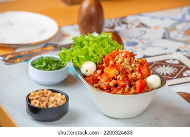 Tomato Salat With Lettuce, White Cheese, Pecan And Walnuts On Side