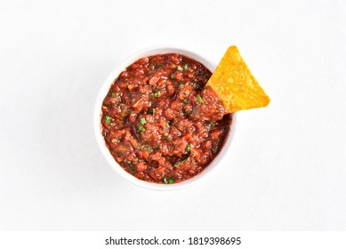 Tomato salsa in bowl over white stone background with free text space. Top view, flat lay - Powered by Shutterstock