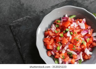 Tomato Salsa On Moody Background, Overhead View