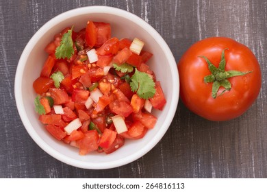 Tomato Salsa Overhead View On A Rustic Background