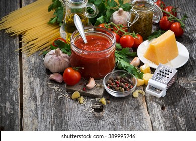 Tomato Sauce And Ingredients For Pasta On A Wooden Background, Horizontal