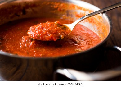 Tomato Sauce With Spoon In Metal Pan