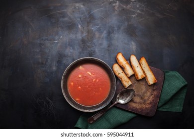 Tomato Soup And Bruschetta On  Old Dark Metallic Table. View From Above. Mexican Soup. 