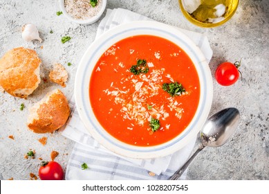 Tomato soup, Gazpacho in white bowl on grey stone background, with ingredients  Copy space top view - Powered by Shutterstock