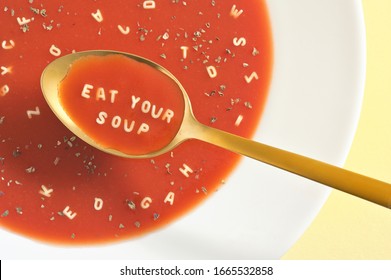 Tomato Soup With Letter Noodles On Spoon