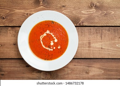 Tomato Soup Viewed From Above. A Classic Comfort Food, Tomato Soup Is Often Enjoyed Near Summer End Or Fall. It Is A Simple And Healthy Soup Using Ripe Tomatoes, Broth And Cream Sometimes Added.