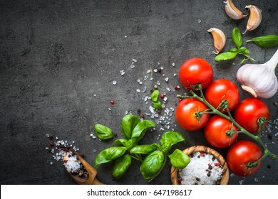 Tomato, Spices Herbs. Ingredients For Cooking. Food Background On Black Slate Table. Top View Copy Space.