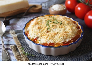 Tomato Vegetable Crumble With Aromatic Herbs And Grated Parmesan Cheese 