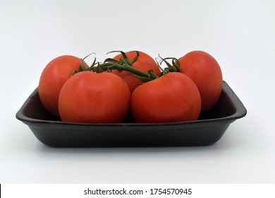 Tomatoes In A Black Plastic Foam Plate