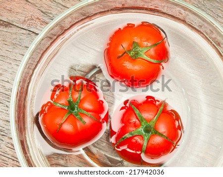 tomatoes in bowl on table 