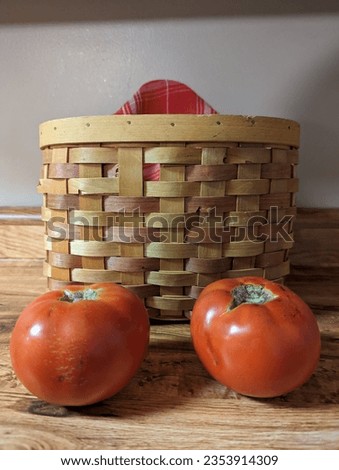 Tomatoes by a whicker basket 