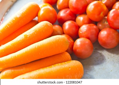 tomatoes, carrots on the table