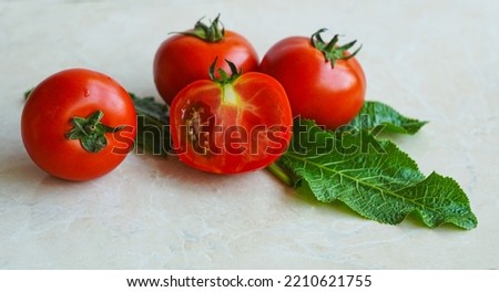                              Tomatoes, cut and uncut tomatoes on a white background  