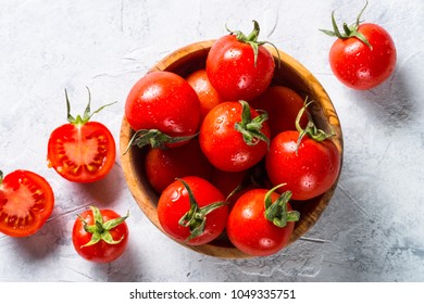 Tomatoes on gray stone table.