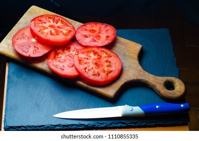 Tomatoes are sliced,background