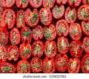 Tomatoes sprinkled with Provencal herbs.Dried tomatoes are a delicacy. - Shutterstock ID 2198327581