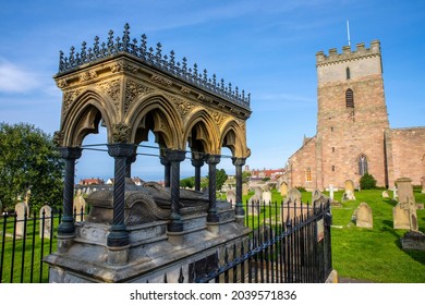 Tomb of Grace Darling in the churchyard of St. Aidans Church in Bamburgh, Northumberland, UK. She was the daughter of a lighthouse keeper and saved 9 people from a shipwreck in 1838. - Shutterstock ID 2039571836