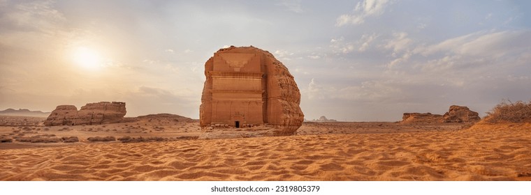 Tomb Lihyan Son of Kuza or Qasr al-Farid at Hegra, Saudia Arabia - most popular landmark in Mada'in Salih archaeological site, sandy desert landscape, morning sun background - high resolution panorama - Shutterstock ID 2319805379