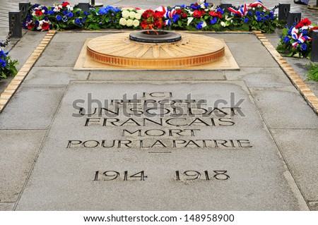 the Tomb of the Unknown Soldier from World War I beneath the Arc de Triomphe, in Paris, France