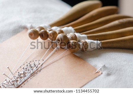 the Tombolo, a particular processing of the interweaving of threads to create fabrics in Italy