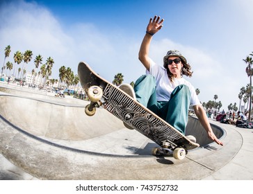 Tomboy Girl Skateboarding in Venice Beach - Powered by Shutterstock