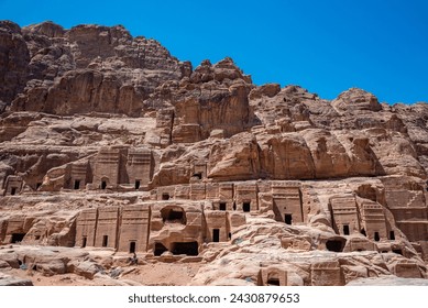 Tombs and dramatic landscape in Petra, Jordan - Powered by Shutterstock