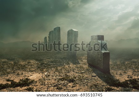 Tombstone and graves in an ancient church graveyard, halloween concept 