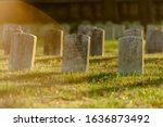 Tombstones in warm Evening Light an Antietam National Cemetery in Sharpsburg, Maryland, USA - with Copy Space