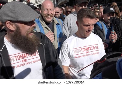 Tommy Robinson walks with a crowd of supporters and media as he leaves the trial at the Old Bailey, London, UK 05/14/19