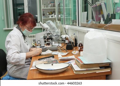 TOMSK, RUSSIA - DECEMBER 9: The Specialist Examines The Analysis In The Laboratory Skin STI Clinic, December 9, 2009 In Tomsk, Russia.