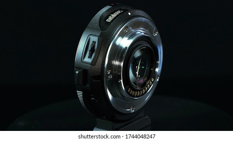 TOMSK, RUSSIA - May 28, 2020: Metabones Speedbooster 0.71 Ultra Standing On A Black Turntable, Micro Four Thirds System, Black Background