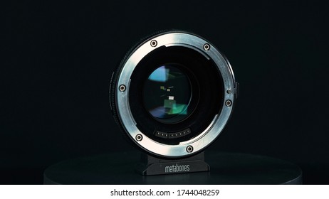 TOMSK, RUSSIA - May 28, 2020: Metabones Speedbooster 0.71 Ultra Standing On A Black Turntable, Micro Four Thirds System, Black Background