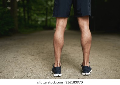 Tone Calf Muscle of a Fit Young Guy Standing at the Park and Facing Backwards.
