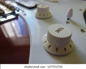 Tone Knob Closeup. Electric Guitar Superstrat Sunburst Colour. Сloseup Deep Focus With Blur, Bokeh.