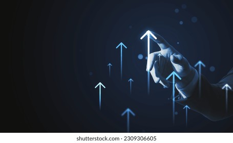 Toned businessman hands pointing at growing upward arrows on dark background. Company growth and increase concept - Powered by Shutterstock