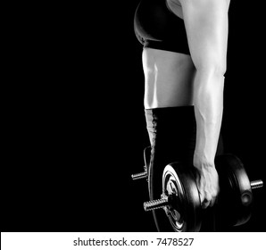 Toned Female Body Builder Lifting Weights