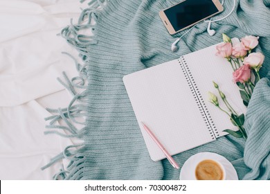 Toned Flat Lay Tablet And Flowers On White Blanket With Turquoise Plaid. Window Light, Space For Text Blog, Posts