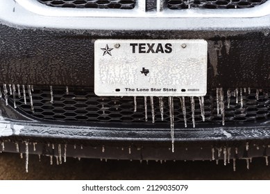 Toned Photo Frozen Texas License Number With Icicles. Icy Frosty Cover Black SUV Car Bumper And Plate Number In Severe Winter Storm. Icing Vehicle On A Winter Day After Freezing Rain Near Dallas, TX