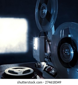 Toned Photo Of The Old Film Projector In The Dark Room