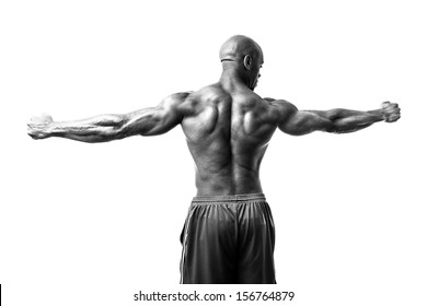 Toned And Ripped Lean Muscle Fitness Man Isolated Over A White Background In High Contrast Black And White.