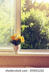 Toned  Summer Yellow Flowers On Window - Sill