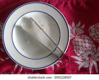 Tongs On Empty Plate After Had Delicious Cookies