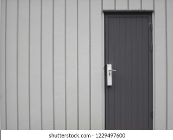 Tongue And Groove Wood Paneling Grey Wall And Door.