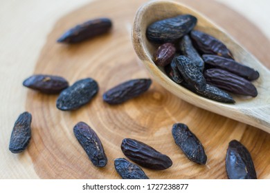 Tonka Beans Isolated With Wooden Spoon, Seads From Dipteryx Odorata Tree Used In Modern Cuisine