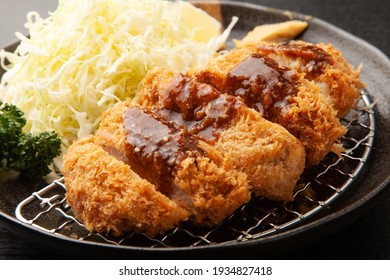 Tonkatsu and shredded cabbage with Worcestershire sauce on a plate